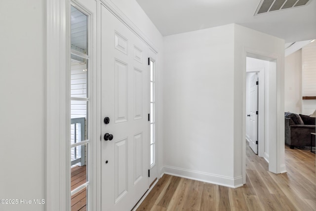 foyer with light hardwood / wood-style flooring