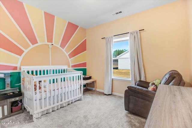 carpeted bedroom with a crib