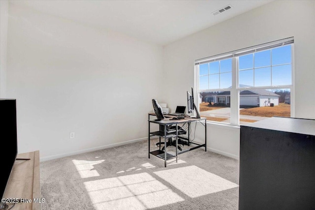 home office featuring light colored carpet