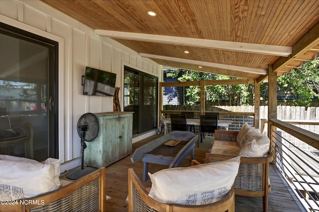 sunroom featuring wood ceiling and lofted ceiling with beams