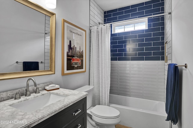 full bathroom featuring shower / bathtub combination with curtain, vanity, and toilet