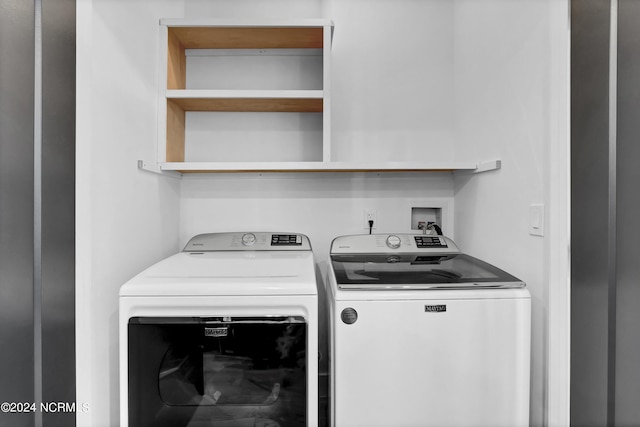 washroom featuring washing machine and dryer