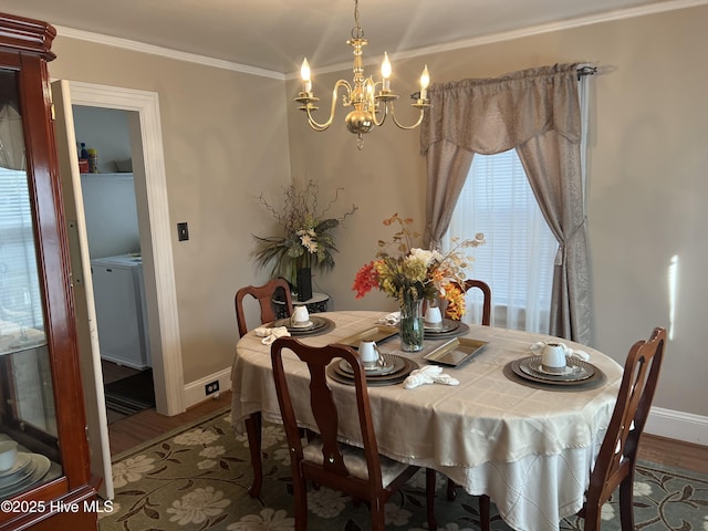 dining room featuring hardwood / wood-style flooring, ornamental molding, and a chandelier