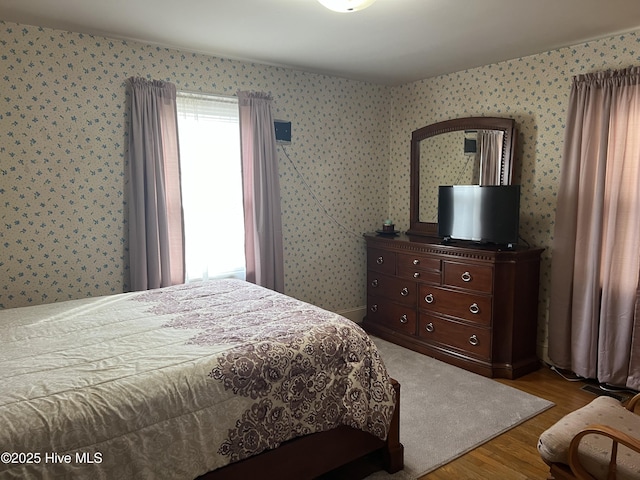 bedroom featuring hardwood / wood-style flooring