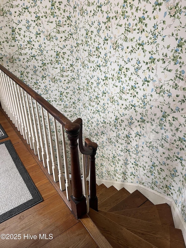 stairway featuring wood-type flooring