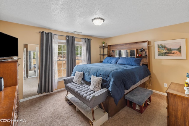 carpeted bedroom featuring a textured ceiling