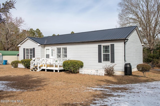 view of front of property with a wooden deck