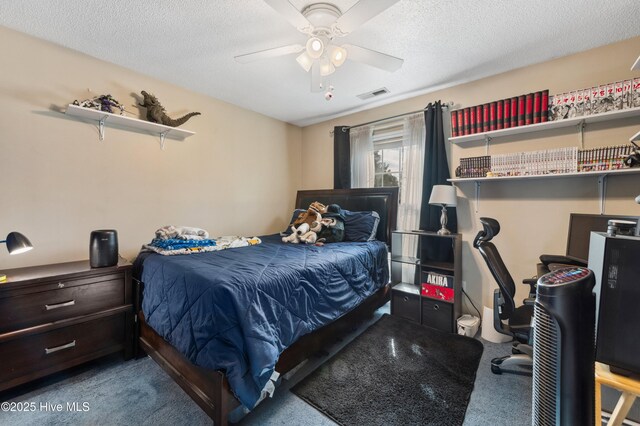 bedroom featuring ceiling fan, a textured ceiling, and carpet