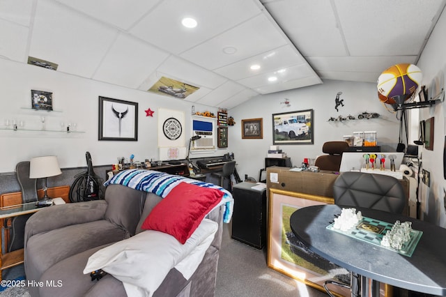 living room featuring lofted ceiling, a paneled ceiling, and carpet