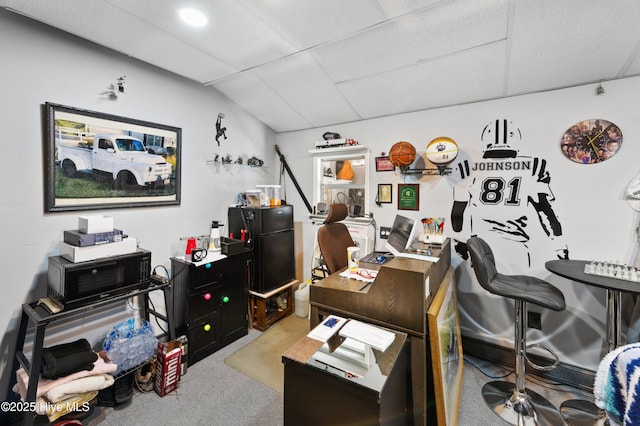 office area with vaulted ceiling and light carpet