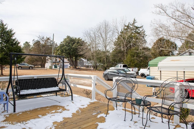 view of snow covered deck