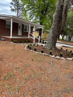 view of front of property featuring covered porch
