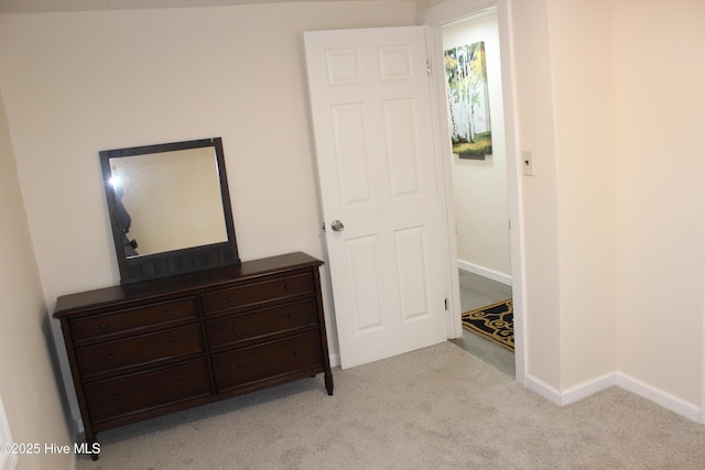 bedroom with light colored carpet