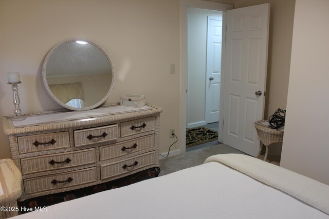carpeted bedroom with baseboards