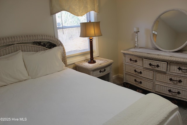 carpeted bedroom with baseboards