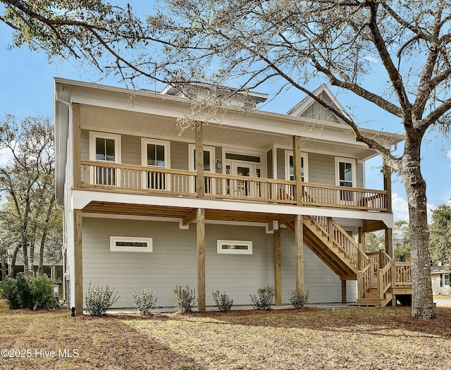 view of front of house with stairway and covered porch