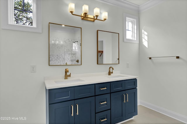 bathroom with double vanity, a tile shower, crown molding, and a sink