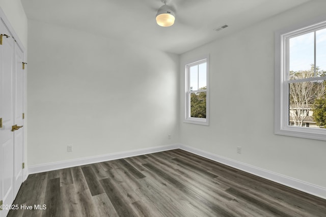 interior space featuring plenty of natural light, baseboards, and visible vents