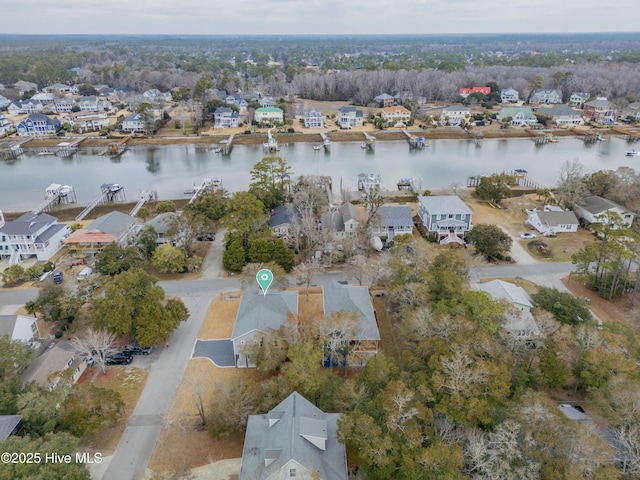 drone / aerial view featuring a residential view and a water view