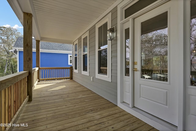 wooden deck featuring covered porch