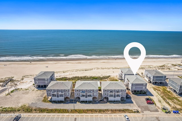 drone / aerial view with a view of the beach and a water view