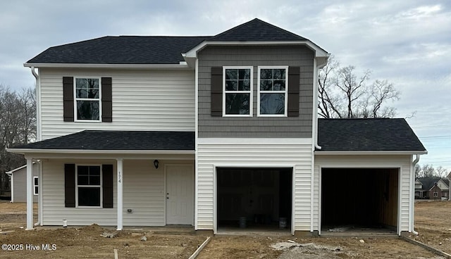 view of front of property featuring a garage and covered porch