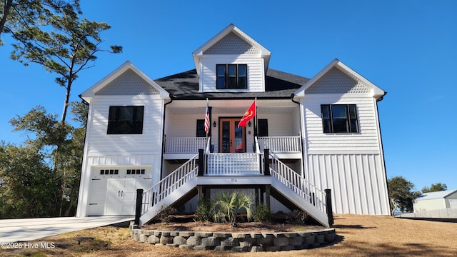 view of front facade with a garage and covered porch