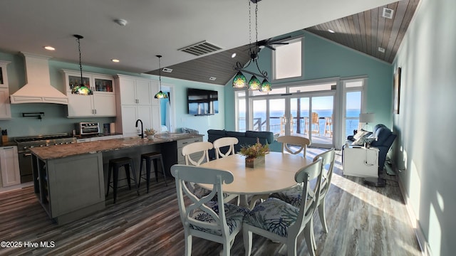 dining space with wood ceiling, high vaulted ceiling, dark hardwood / wood-style floors, and sink