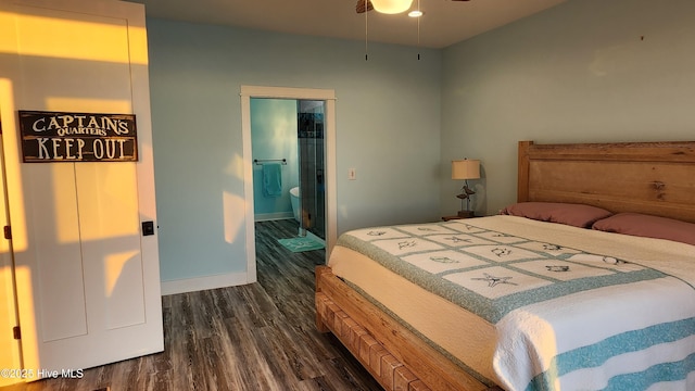 bedroom featuring dark hardwood / wood-style floors and connected bathroom