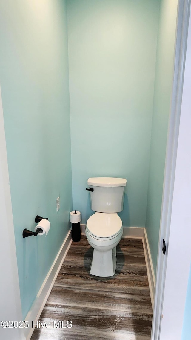 bathroom featuring toilet and hardwood / wood-style floors