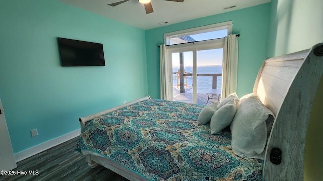 bedroom with dark wood-type flooring and ceiling fan