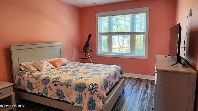 bedroom featuring dark hardwood / wood-style flooring