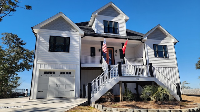 view of front of home with a garage and covered porch