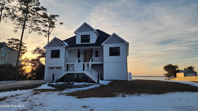 view of front of home with a garage and covered porch