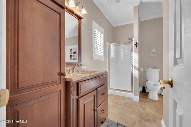 bathroom with vanity, crown molding, toilet, and walk in shower