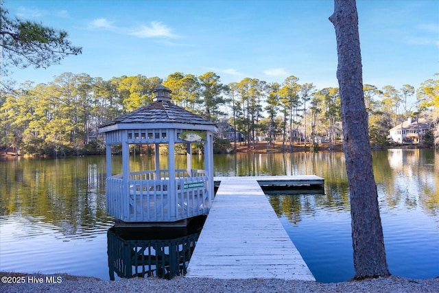 view of dock featuring a gazebo and a water view