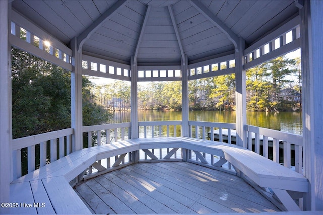 wooden terrace featuring a gazebo and a water view