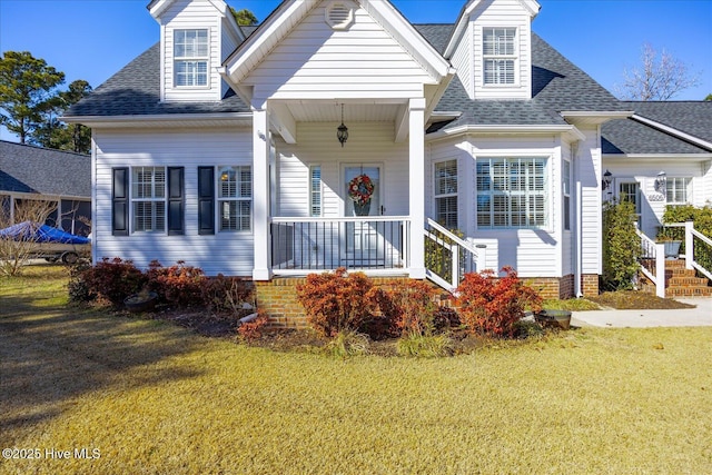 view of front of house featuring a front yard and a porch