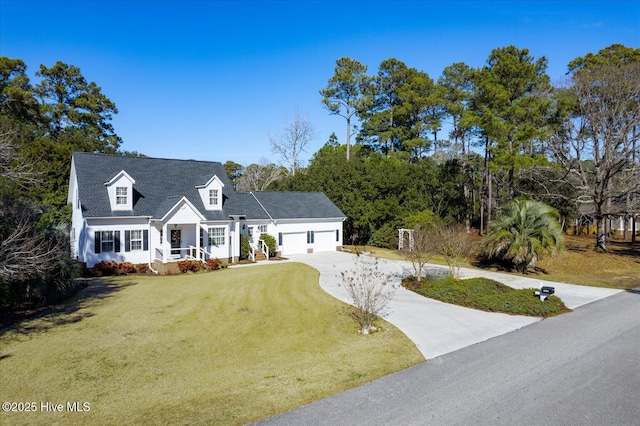 view of front of property with a garage and a front lawn