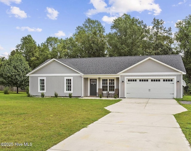 ranch-style home featuring a garage and a front yard