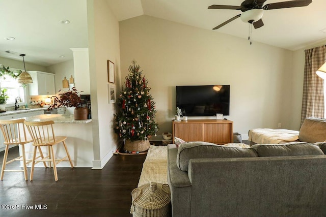 living room with lofted ceiling, sink, dark wood-type flooring, and ceiling fan