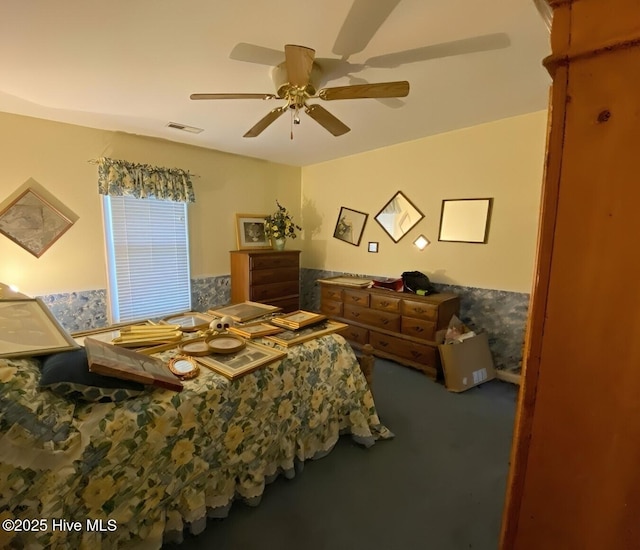 bedroom with ceiling fan and carpet flooring