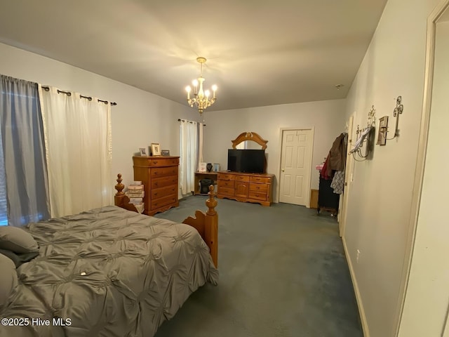 bedroom with a chandelier and dark colored carpet