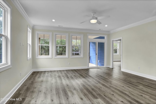 unfurnished living room featuring wood finished floors, a ceiling fan, baseboards, and ornamental molding