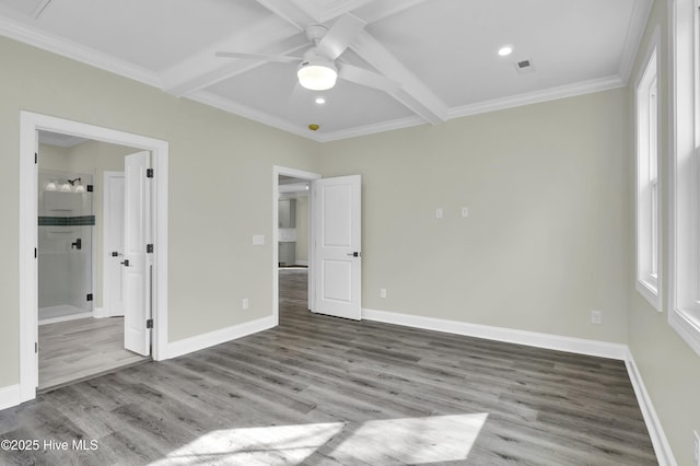 unfurnished bedroom with beam ceiling, visible vents, baseboards, and wood finished floors