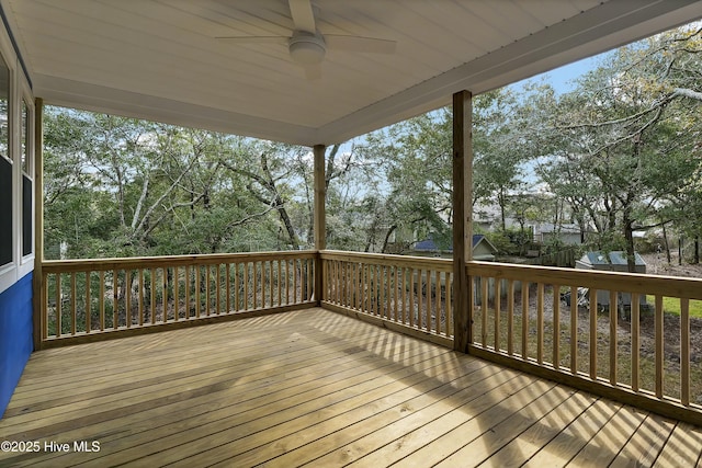 wooden deck featuring ceiling fan