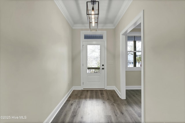 entryway featuring baseboards, wood finished floors, and crown molding