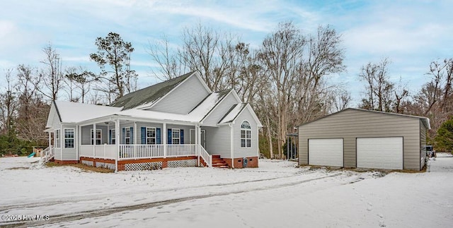 view of front of home with an outbuilding, a garage, and covered porch