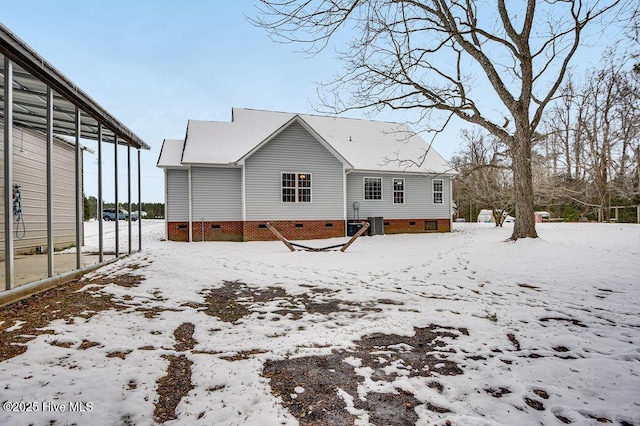 view of snow covered house