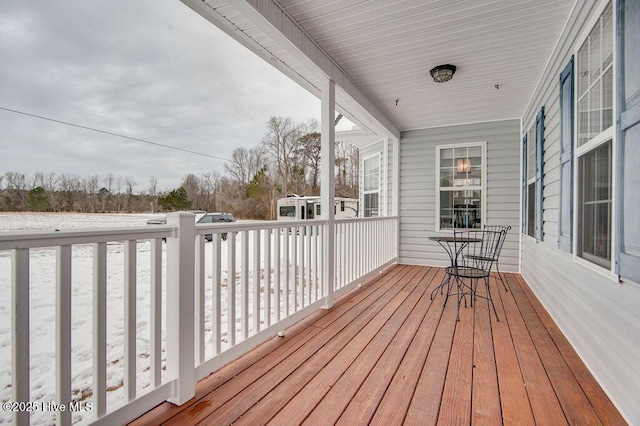 wooden deck featuring covered porch